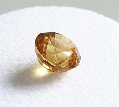 Zircon, faceted, round cut