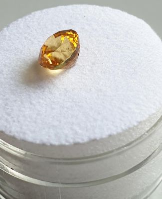 Zircon, faceted, round cut