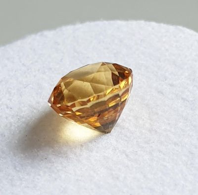 Zircon, faceted, round cut