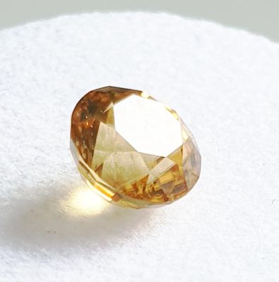 Zircon, faceted, round cut